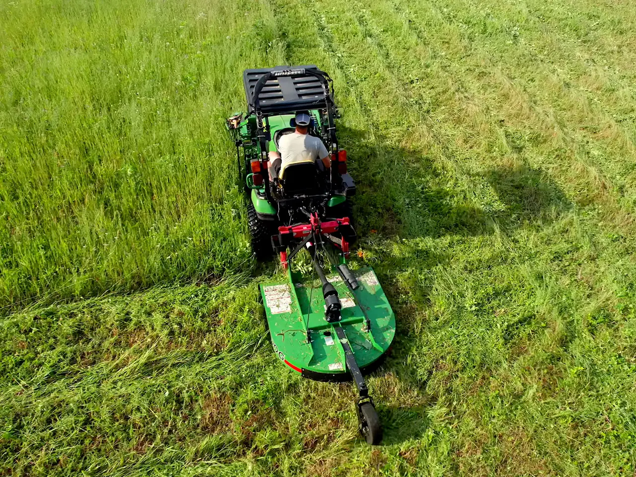Freshly mowed pasture and fence line on rural land near Rayville, LA